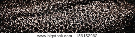 Header from a od chainmail middle ages knight armor background