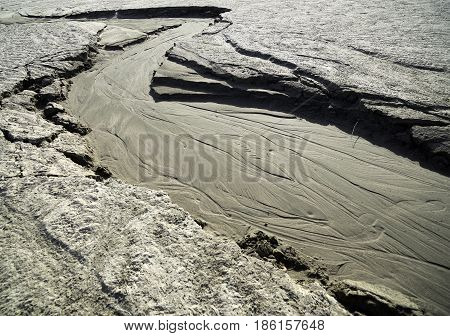 Dried creek with a pattern on the sand. Siberia, spring, the Ob Sea.