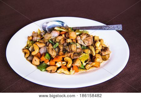 Plates of Asian food - chicken with vegetables, Myanmar. (Burama)