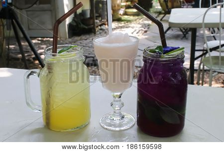 Glass jars with fresh delicious butterfly pea and lemon juice and rose tea Smoothie