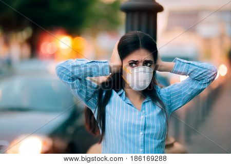 Girl With Mask Covering her Ears Because of Noise Pollution