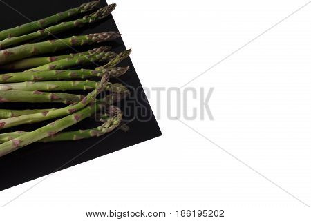 Asparges on Black Sheet Isolated on white.
