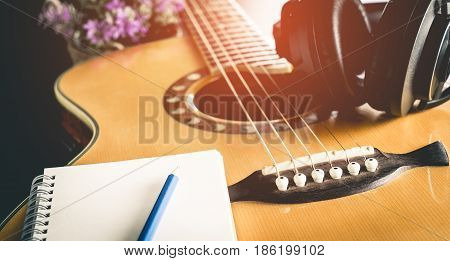 Music composer equipment with guitar and headphone for songwriting