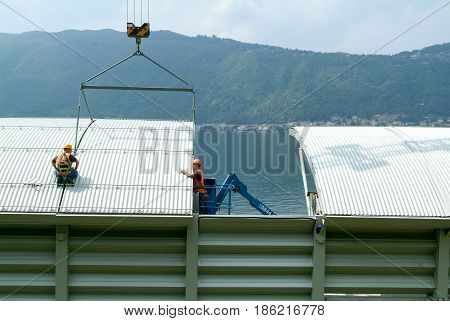 Workers During The Installation Of Noise Barriers On The Highway