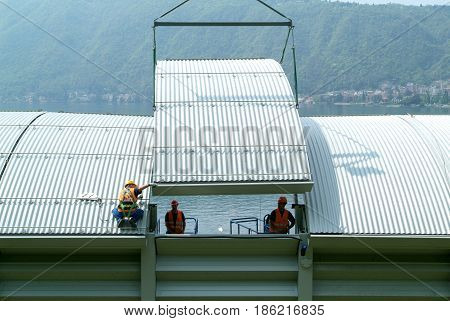 Workers During The Installation Of Noise Barriers On The Highway