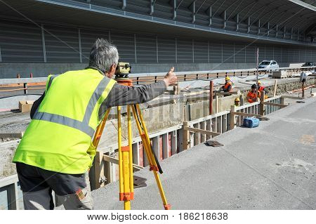 Surveyor Engineer Worker Making Measuring With Theodolite Instrument Equipment