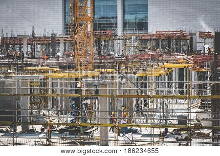 Cranes And Construction Workers Onconstruction Site