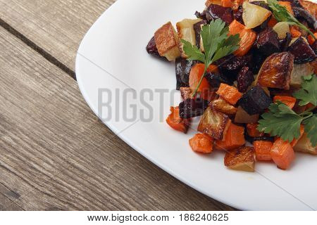 Salad baked beetroot fresh carrots and potatoes. Healthy food from organic products