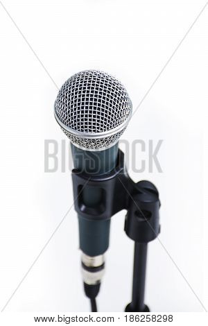 Professional vocal microphone on stand isolated on white background. audio equipment for studio and concert