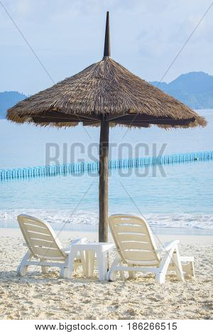 couples of white chairs on traveling destination sea beach