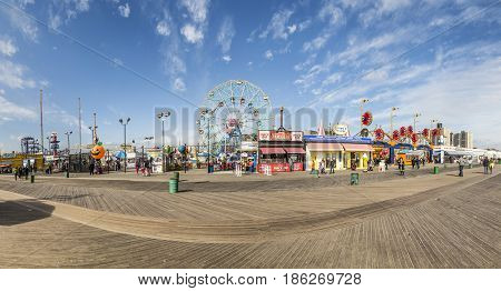 People Visit Famous Old Promenade At Coney Island, The Amusement Beach Zone Of New York