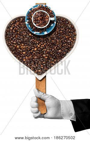Love Coffee - Hand of a waiter holding a symbol with roasted coffee beans in the shape of a heart with a coffee cup. Isolated on white background
