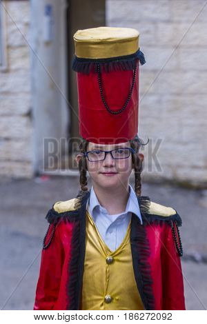 JERUSALEM - MARCH 13 : Ultra Orthodox child during Purim in Mea Shearim Jerusalem on March 13 2017 Purim is a Jewish holiday celebrates the salvation of the jews from genocide in ancient Persia