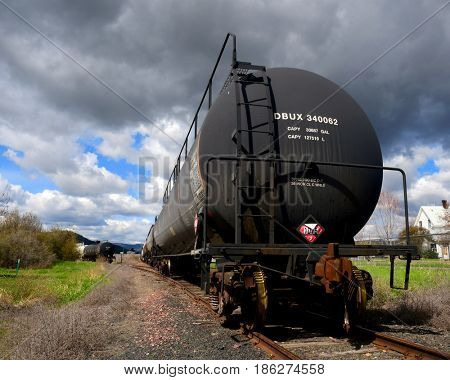 KALISPELL, MONTANA, USA - May 1, 2017: Train cars carrying natural gas parked in a rail yard
