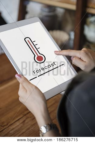 Hands working on digital device network graphic overlay