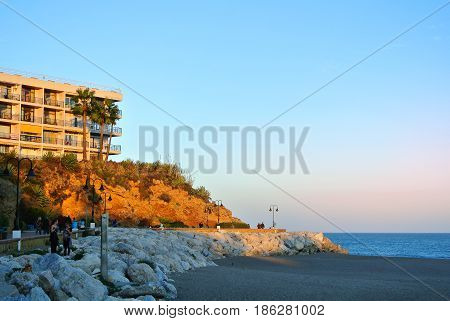 Torremolinos, Spain - February 14, 2014: Promenade Of Torremolinos, A Road, Hotels, Rocks, Blooming
