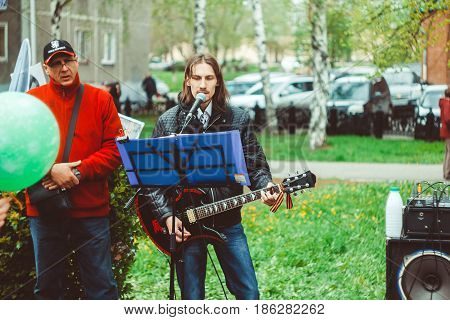Russia Siberia Novokuznetsk - may 9 2017: musicians sing songs on the street on victory day