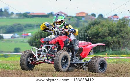 Unidentified Racer Rides A Quad Motorbike.