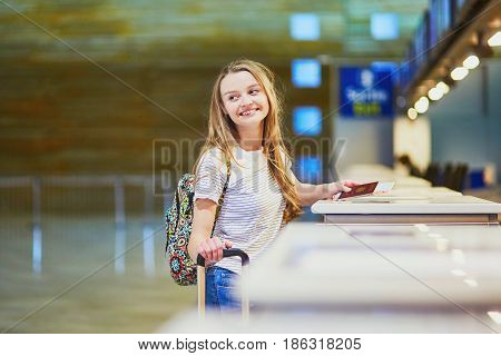 Traveler With Backpack In International Airport At Check-in Counter