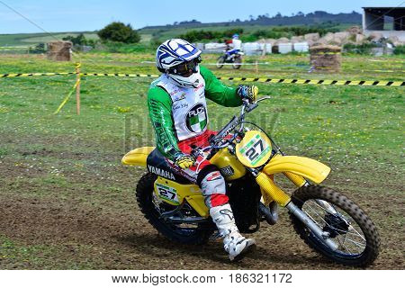 Unidentified Racer Rides A Classic Motorcycle.