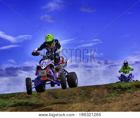 Unidentified Racer Rides A Quad Motorbike.