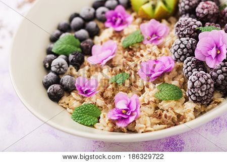 Tasty And Healthy Oatmeal Porridge With Fruit, Berry And Flax Seeds. Healthy Breakfast. Fitness Food