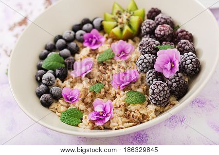 Tasty And Healthy Oatmeal Porridge With Fruit, Berry And Flax Seeds. Healthy Breakfast. Fitness Food