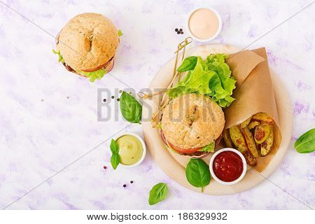 Big Sandwich - Hamburger With Juicy Beef Burger, Cheese, Tomato, And Red Onion On Light Background A