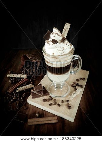 Coffee cocktail with whipped cream in an Irish coffee mug. Peculiar photo edition