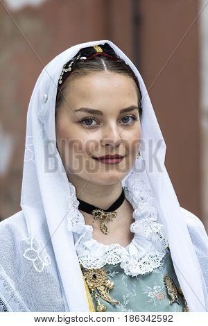 CAGLIARI, ITALY - MAY 1, 2017: 361 Religious procession of Sant'Efisio - portrait of a beautiful woman in traditional Sardinian costume - Sardinia