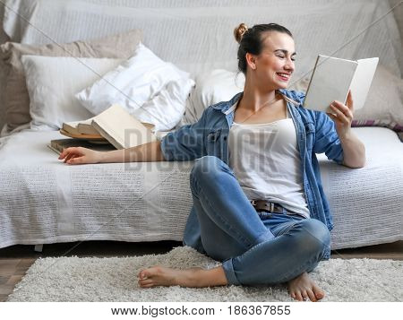 Girl Reading A Book In A Cozy Room