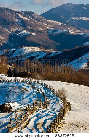 Romanian Landscape. Foggy and sunny day on wild transylvania hills. Holbav. Romania. Low key dark background spot lighting and rich Old Masters