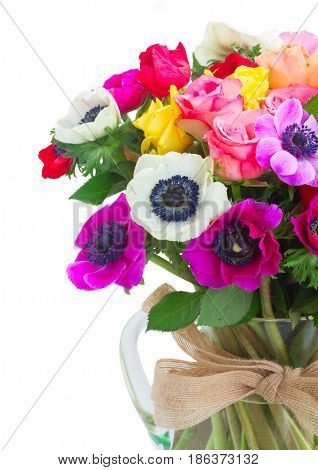 Fresh colorful Anemones and roses flowers close up bouqet isolated on white background