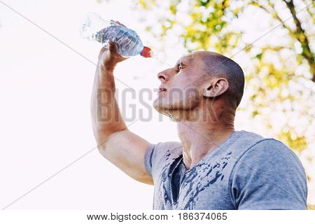 athlete is refreshing himself with water, sport and healthy lifestyle