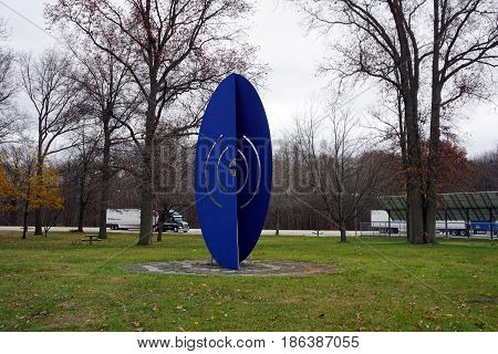 NEW BUFFALO, MICHIGAN / UNITED STATES - NOVEMBER 20, 2016: A big blue oblong sculpture stands in the lawn at the New Buffalo Welcome Center 707.