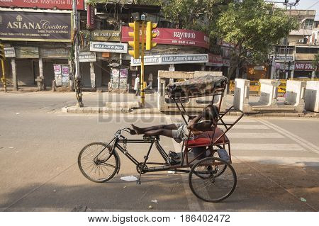 DELHI INDIA-JUN 6 : driver nap in richshaw at chandni chowk rickshaw is three wheeler bike taxi in local area of delhi on june 6 2015 india