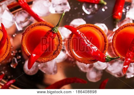 Bloody Mary Cocktail With Chili Pepper, Ice And Celery.