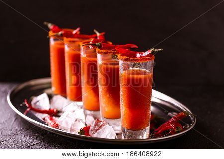 Bloody Mary Cocktail With Chili Pepper, Ice And Celery.
