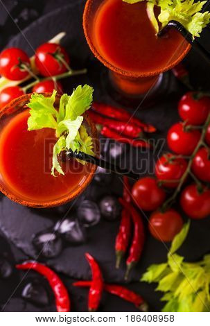 Bloody Mary Cocktail With Chili Pepper, Ice And Celery.