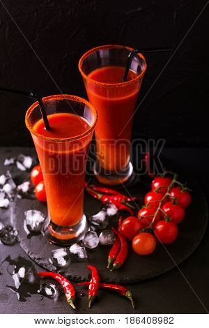 Bloody Mary Cocktail With Chili Pepper, Ice And Celery.