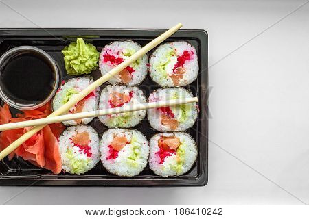 The Plate Of Sushi With Soy Sauce, Wasabi And Chopsticks