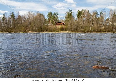Russia. Leningrad region. Losevo. On the Vuoksa river a rocky shore with rapids and a bridge