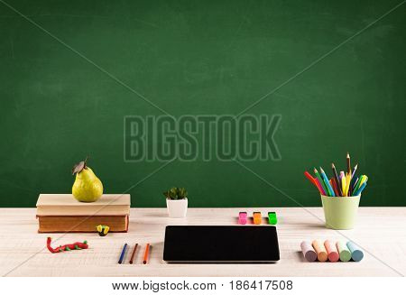 Back to school concepty with clear blackboard background, desk, items