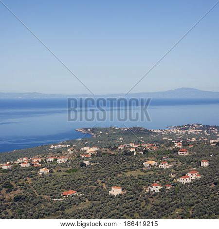 village of stoupa and blue sea seen from the mountains behind it on part of peloponnese called mani in greece