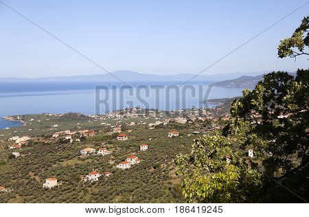 village of stoupa and blue sea seen from the mountains behind it on part of peloponnese called mani in greece