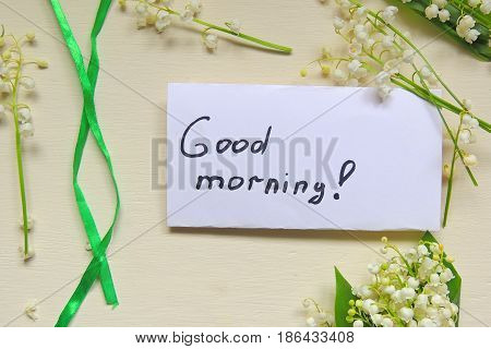 The inscription Good morning and lilies of the valley