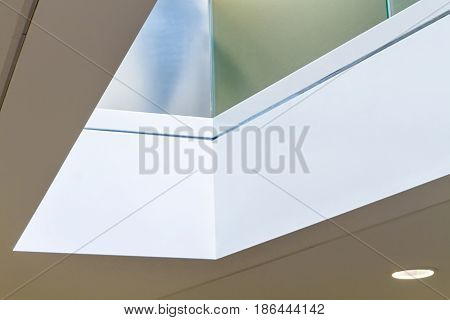 Corner detail of atrium with light reflected from above. Architectural details of premises