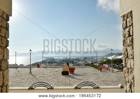 View of a square with lampposts and terrace overlooking the sea in Sperlonga Lazio Italy