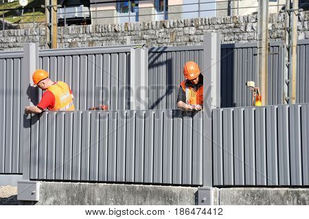Workers During The Installation Of Noise Barriers On The Railway
