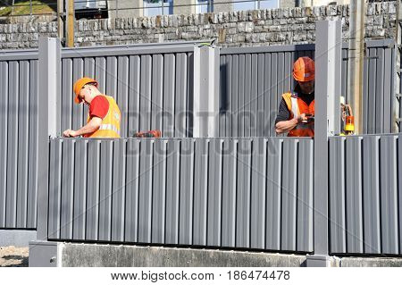 Workers During The Installation Of Noise Barriers On The Railway